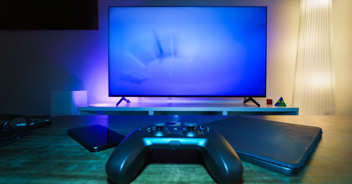 A stylish and ambient gaming setup featuring a controller, smart devices, and a TV in a lit living room.