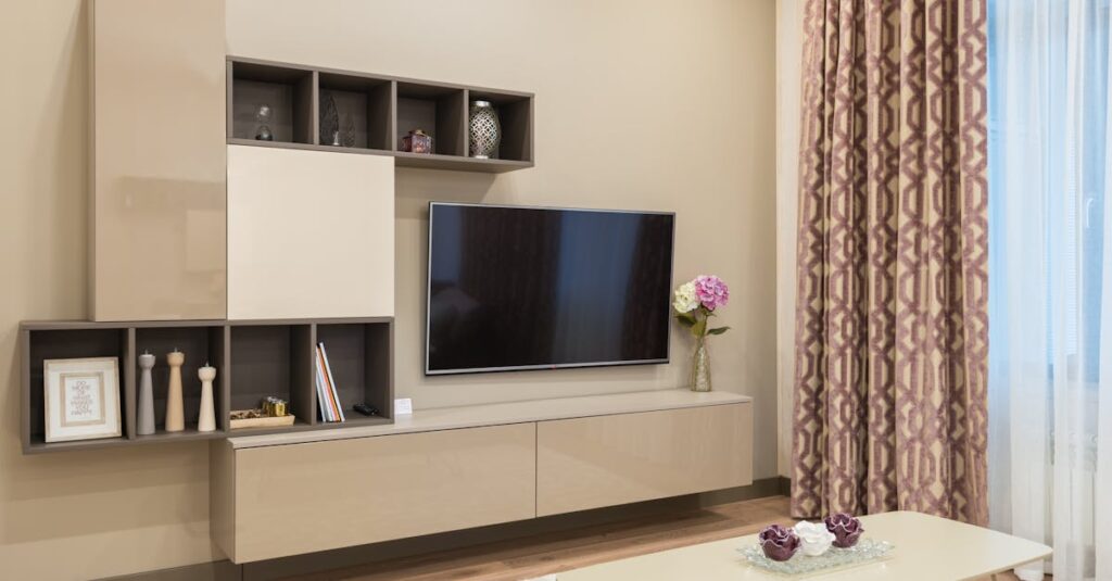 Elegant living room with modern furniture, TV, and stylish decor.