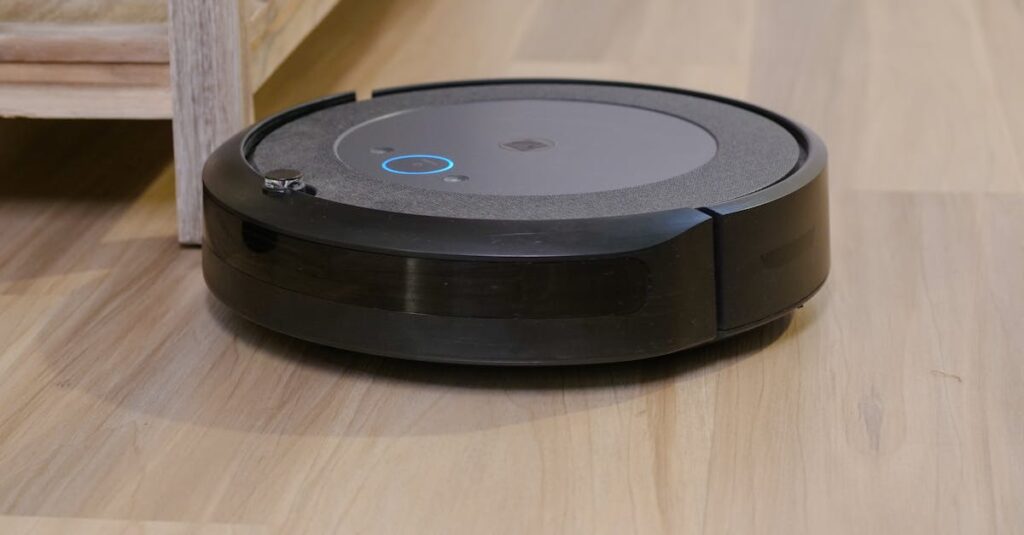 Autonomous vacuum cleaner navigating wooden floor indoors, showcasing smart home technology.